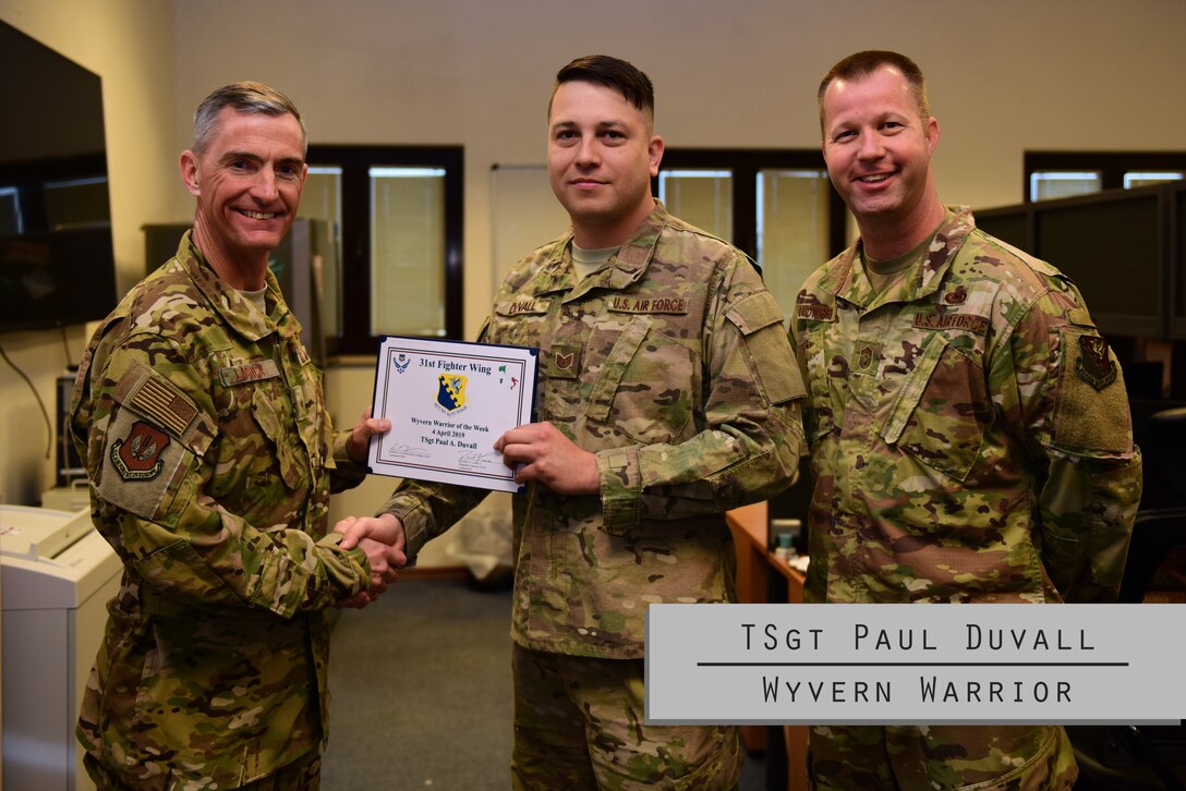 The Wyvern Warrior of the week is TSgt Paul Duvall. Duvall, as the NCOIC of Emergency Management Training, is responsible for the roll out of the revamped CBRN Defense Course placing Aviano at the forefront of the Air Force’s effort to improve readiness.
Duvall experienced many challenges as a child. He grew up in foster care and even faced being homeless. When asked about a defining moment in his life, he stated, “When I was accepted to the Rochester Better Chance Program.  Because it took me off of the streets and gave me a temporary home and educational benefits.” 
You’ve come a long way, Duvall. But don’t stop yet! Keep up the great work and you’ll reach your career goal of attaining SNCO.