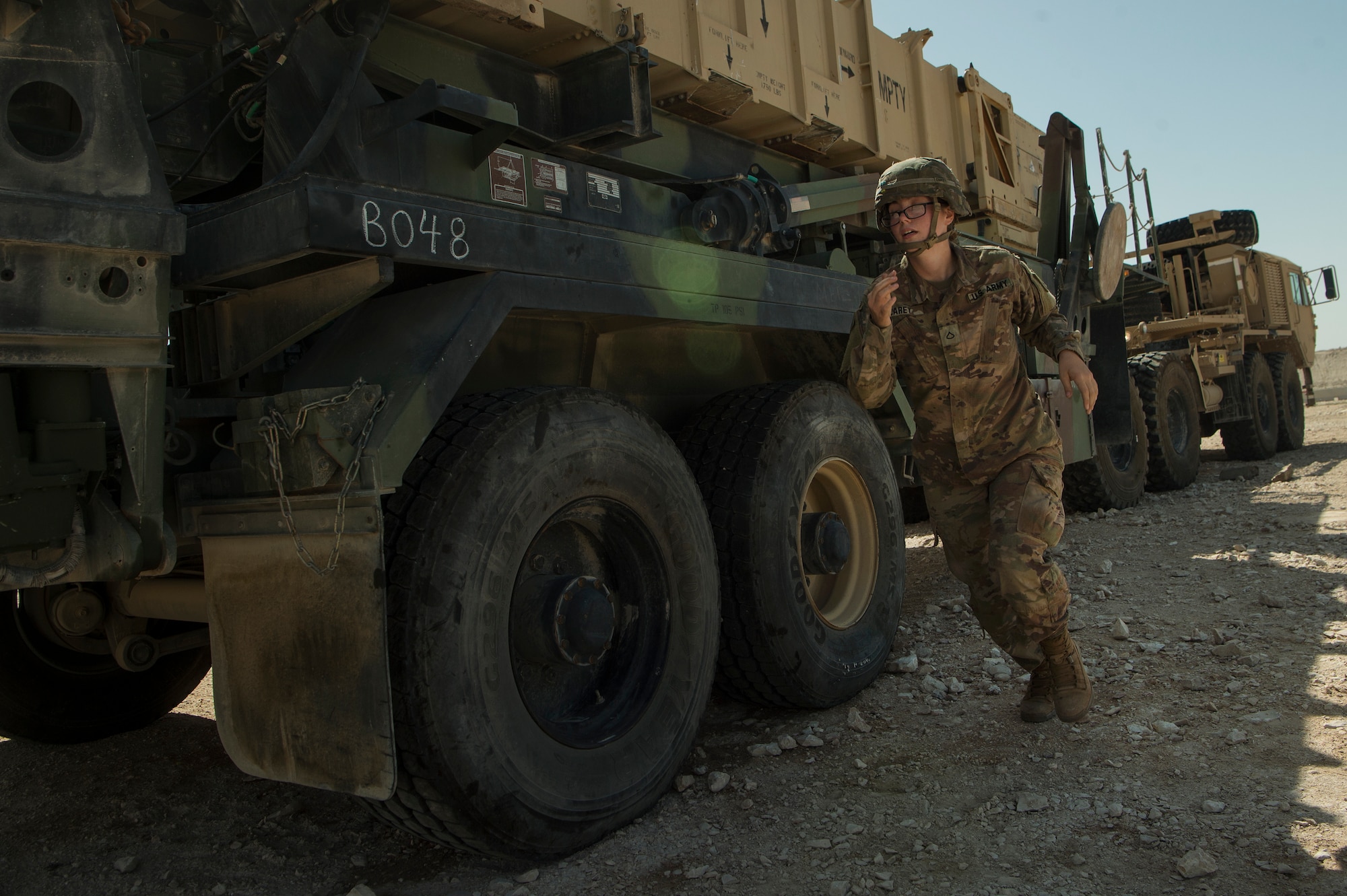 U.S. Army Pfc. Abbigail Carey, Charlie Company, 1st Battalion, 43rd Air Defense Artillery (ADA) Regiment, 11th ADA Brigade patriot missile maintainer and operator, sprints around a training launcher while performing patriot missile readiness drills at Al Udeid Air Base, Qatar, April 16, 2019. Soldiers of the 1-43rd ADA Battalion provide the installation with an air defense capability, protecting personnel, assets and operations here from potential air threats. (U.S. Air Force photo by Tech. Sgt. Christopher Hubenthal)
