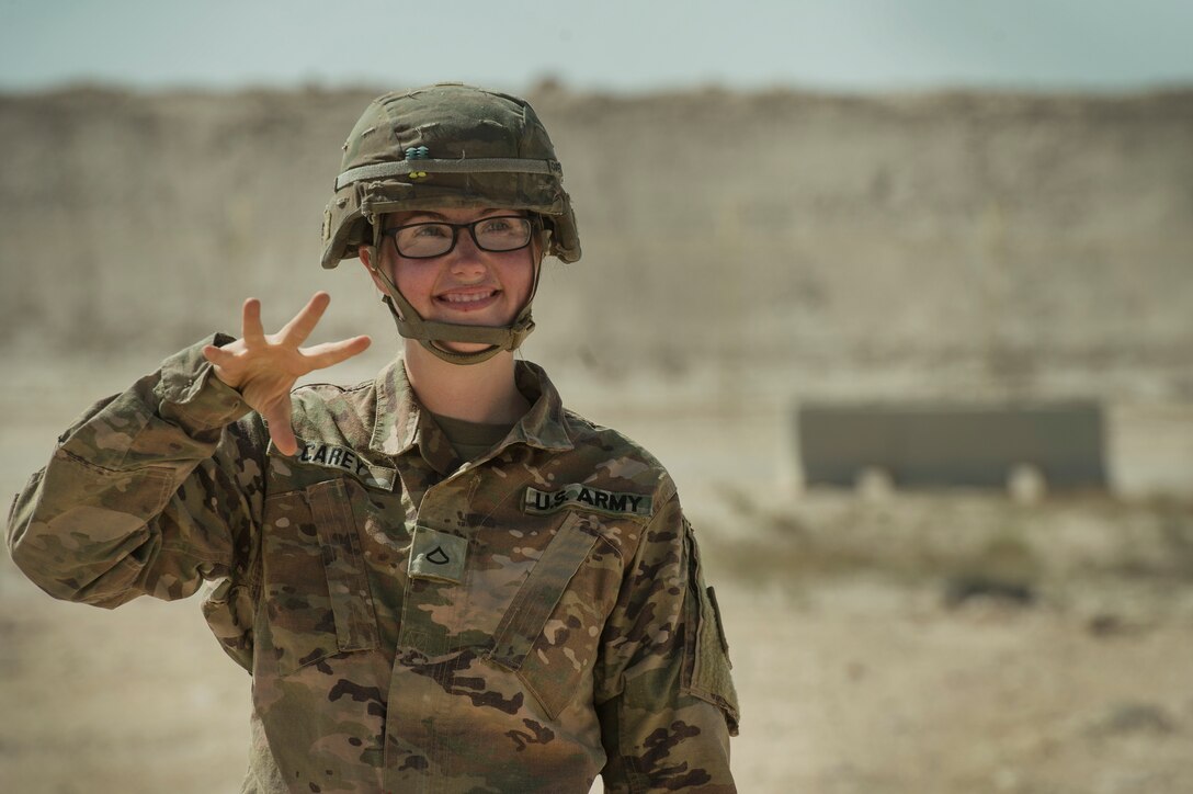 U.S. Army Pfc. Abbigail Carey, Charlie Company, 1st Battalion, 43rd Air Defense Artillery (ADA) Battalion, 11th ADA Brigade patriot missile maintainer and operator, acts as a ground guide while performing patriot missile readiness drills at Al Udeid Air Base, Qatar, April 16, 2019. Soldiers of the 1-43rd ADA Battalion provide the installation with an air defense capability, protecting personnel, assets and operations here from potential air threats. (U.S. Air Force photo by Tech. Sgt. Christopher Hubenthal)