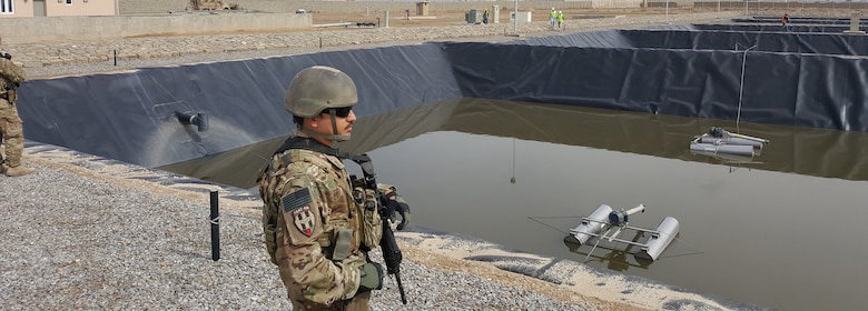 TSGT Freeman, TAAC-AIR, Providing Security in front of the Aeration Pond. TAAC-AIR is also the USACE customer.