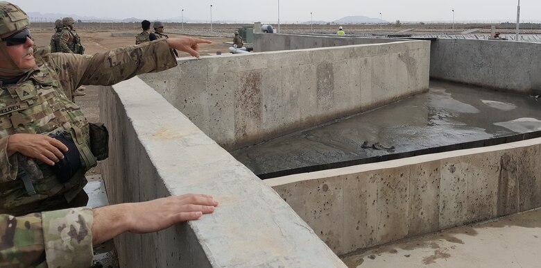 USACE Construction Engineer, Mr. James Fielden, points out to TAAC-AIR (customer) the layout/configuration of the Headworks.