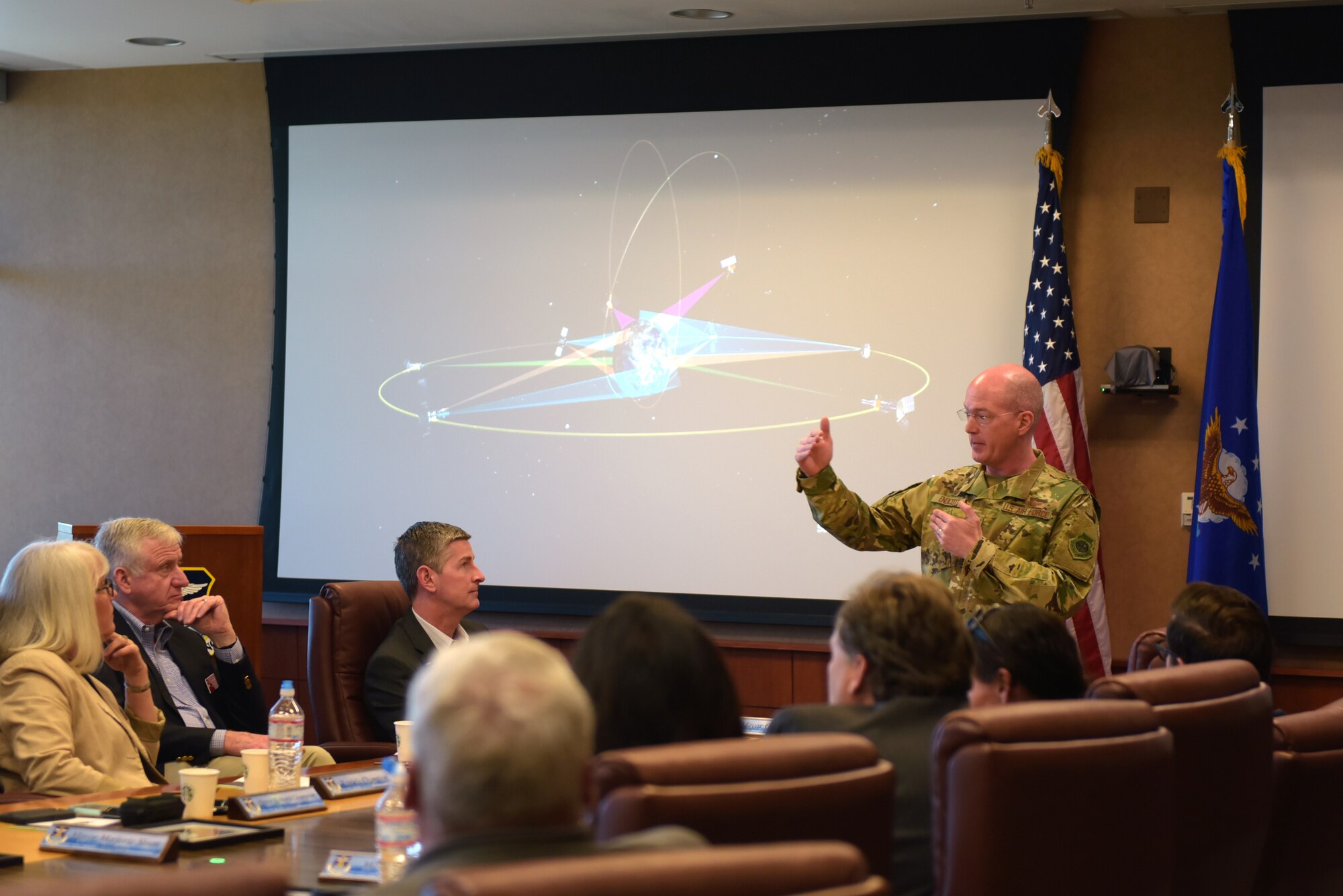 Col. Troy Endicott, 460th Space Wing commander, briefs about satellites to several Metro-Denver mayors at Buckley Air Force Base, Colorado, April 19, 2019.