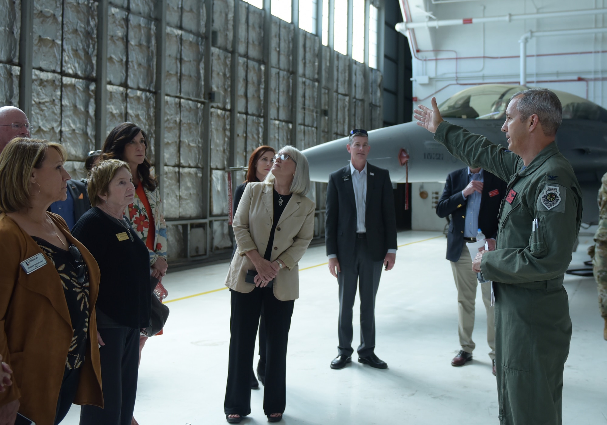 Col. Mitchel Neff, 140th Maintenance Group commander, briefs several Metro-Denver mayors about the F-16 Fighting Flacon at Buckley Air Force Base, Colorado, April 19, 2019.
