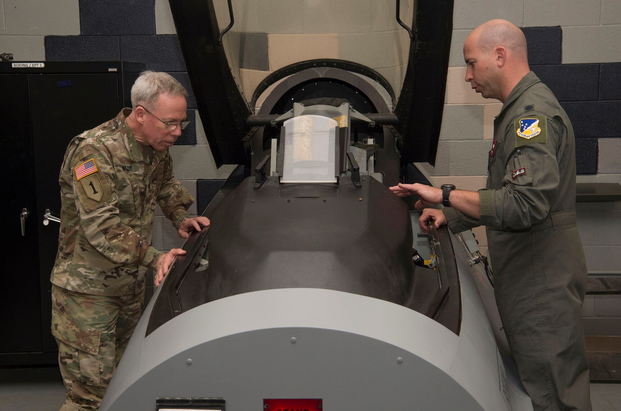 Lt. Col. Eric Janski, 54th Operations Support Squadron director of staff, shows U.S. Army Brig. Gen. Gregory Brady, White Sands Missile Range installation commander, a model of an F-16 Fighting Falcon cockpit, April 18, 2019, on Holloman Air Force Base, N.M. Brady visited Holloman to gain a better understanding of the base’s overall mission. (U.S. Air Force photo by Airman 1st Class Quion Lowe)