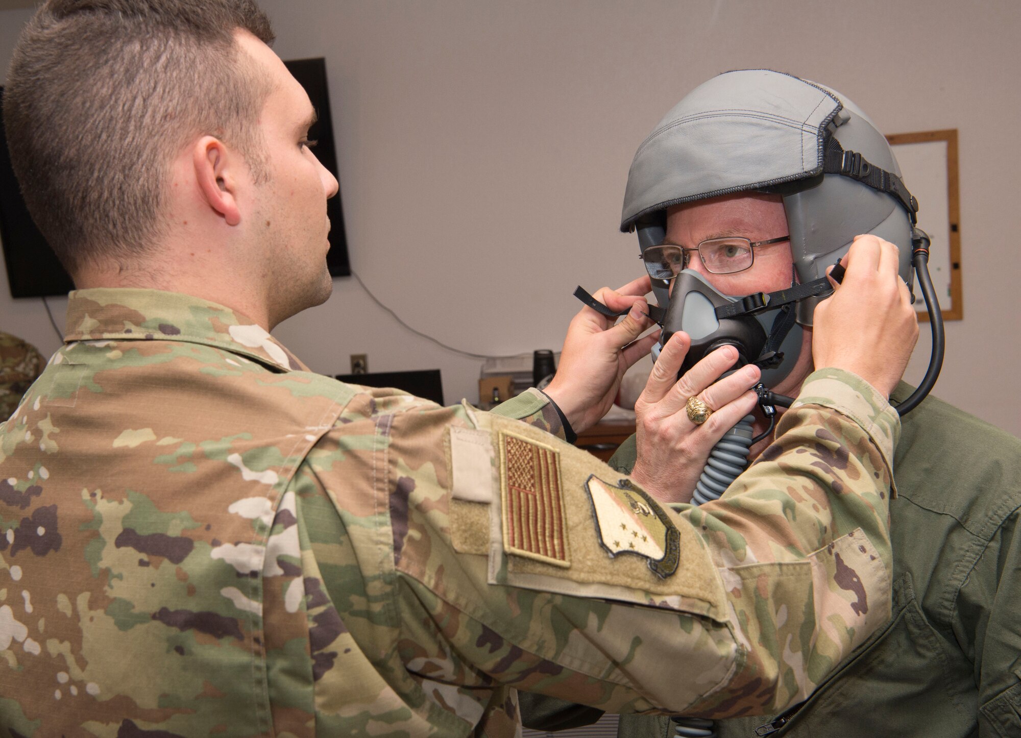 U.S. Army Brig. Gen. Gregory Brady, White Sands Missile Range installation commander gets assistance with putting his helmet on from Staff Sgt. Daniel Locke, 54th Operations Support Squadron Aircrew Flight Equipment technician, April 18, 2019, on Holloman Air Force Base, N.M. Brady visited Holloman to gain a better understanding of the base’s overall mission. (U.S. Air Force photo by Airman 1st Class Quion Lowe)