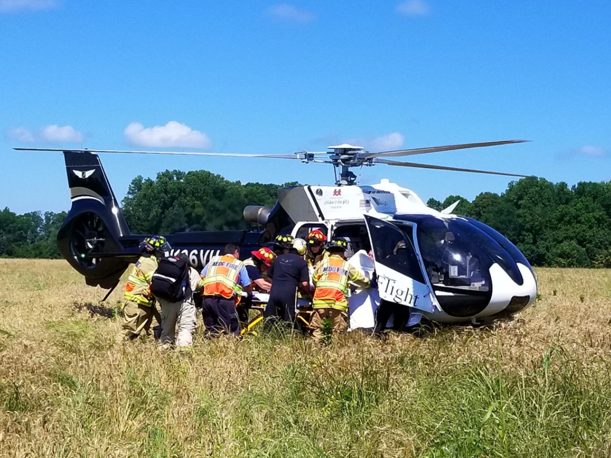 Arnold Air Force Base paramedics and firefighters load a patient into a Vanderbilt LifeFlight helicopter following a motor vehicle accident near the Morris Ferry dock. The base fire department is trained to work with local aeromedical evacuation teams whenever serious injury or illness requires rapid transport to a local hospital or certified trauma center. (Courtesy photo)