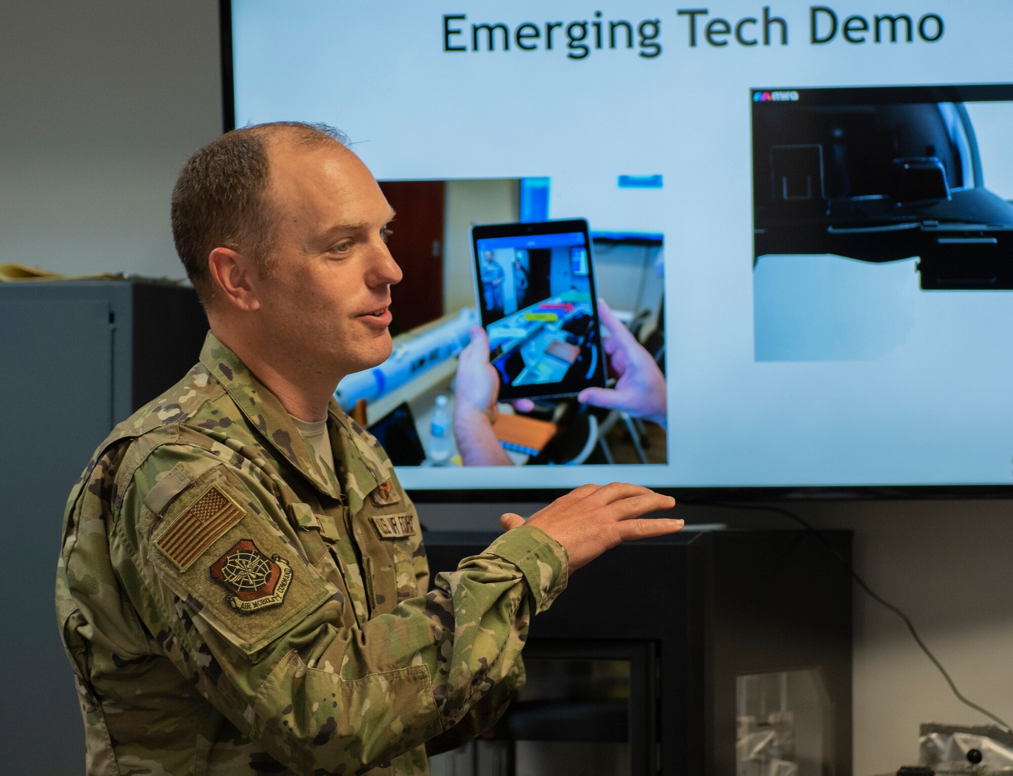 U.S. Air Force Col. Matthew Leard, 60th Air Mobility Wing vice commander, delivers a briefing at the Phoenix Spark facility, April 16, 2019, at Travis Air Force Base, California. Phoenix Spark showcases Travis AFB’s innovation effort by empowering Airmen to innovate, collaborate and discover solutions. (U.S. Air Force photo by Heide Couch)