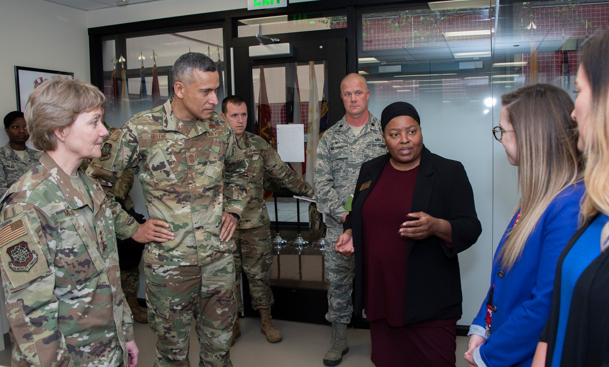 U.S. Air Force Gen. Maryanne Miller, left, Air Mobility Command commander, and Chief Master Sgt. Terrence Greene, center left, AMC command chief, listen to a presentation given by Shirley Collins, 60th Force Support Squadron, during a visit to the Teddy’s Watch child care facility at David Grant USAF Medical Center, Travis Air Force Base, California, April 16, 2019. During the four-day base tour Miller and Greene met with Airmen across Travis to see how the base enhances AMC’s global mobility capabilities. (U.S. Air Force photo by Heide Couch)