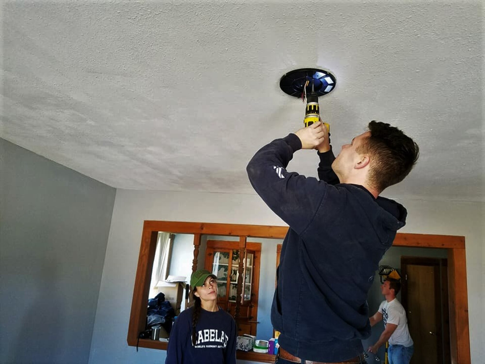 A group of student pilots from Vance Air Force Base, Oklahoma, volunteered with the local Habitat for Humanity to help paint, do some small repairs and install light fixtures and fans during a critical home repair after a local veteran’s home caught fire. (Courtesy photo)
