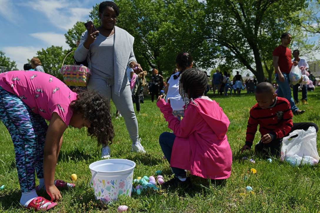Families sort through Easter eggs at the Bunnies and Eggs, egg hunt on Joint Base Andrews, Md., April 20, 2019.