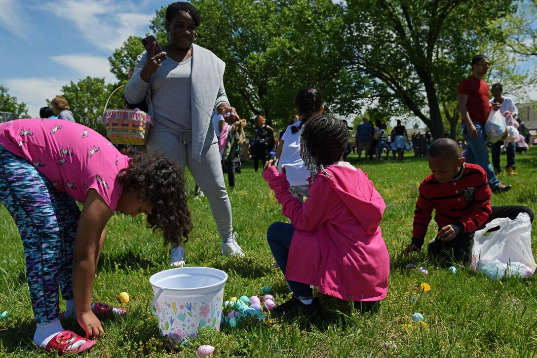 Families sort through Easter eggs at the Bunnies and Eggs, egg hunt on Joint Base Andrews, Md., April 20, 2019.