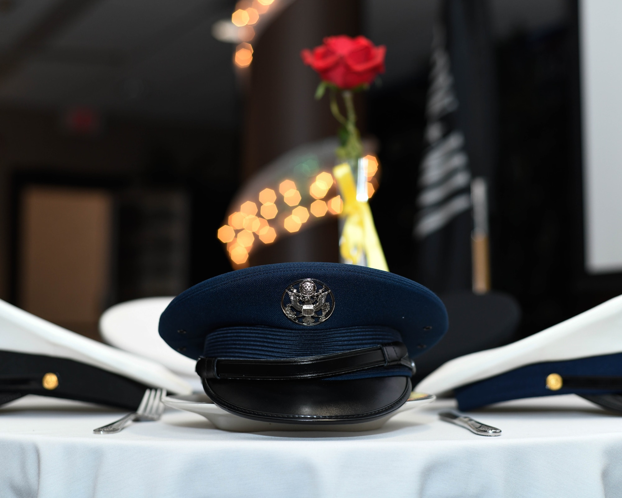 A U.S. Air Force service cap sits alongside the caps of its four sister branches for a POW-MIA Table of Honor during the 910th Airlift Wing’s annual awards banquet in the Community Activity Center here, April 6, 2019.