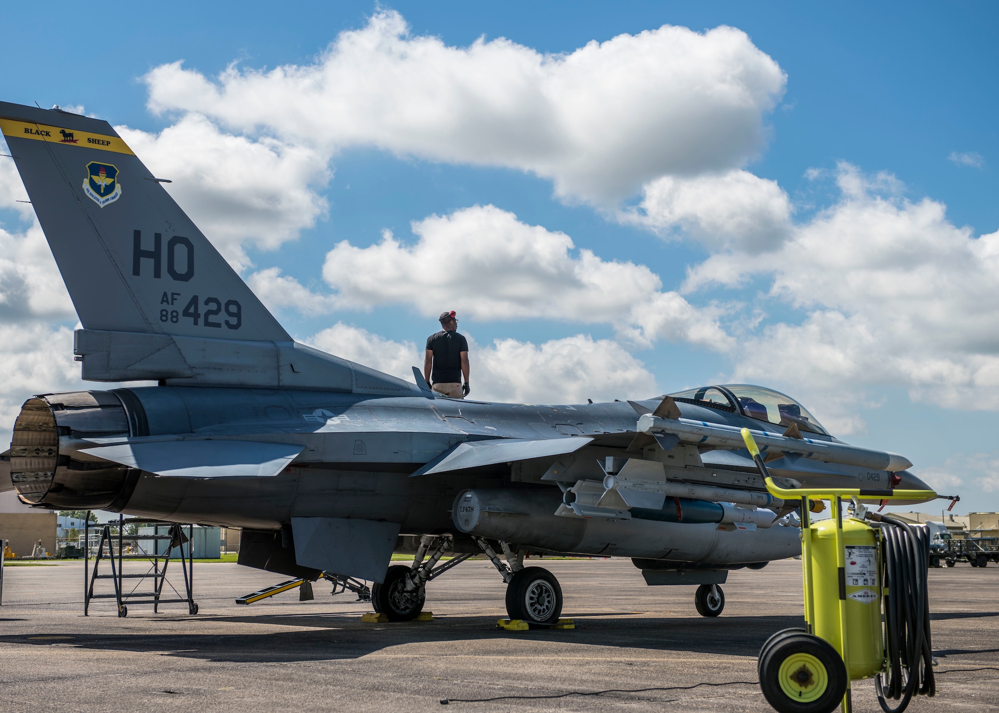 An 8th Fighter Squadron maintainer stands on an F-16 Fighting Falcon, April 9, 2019, on Naval Air Station Joint Reserve Base New Orleans, La. Of the 158 personnel that came on the temporary duty assignment, 106 were F-16 maintainers. (U.S. Air Force photo by Airman 1st Class Kindra Stewart)