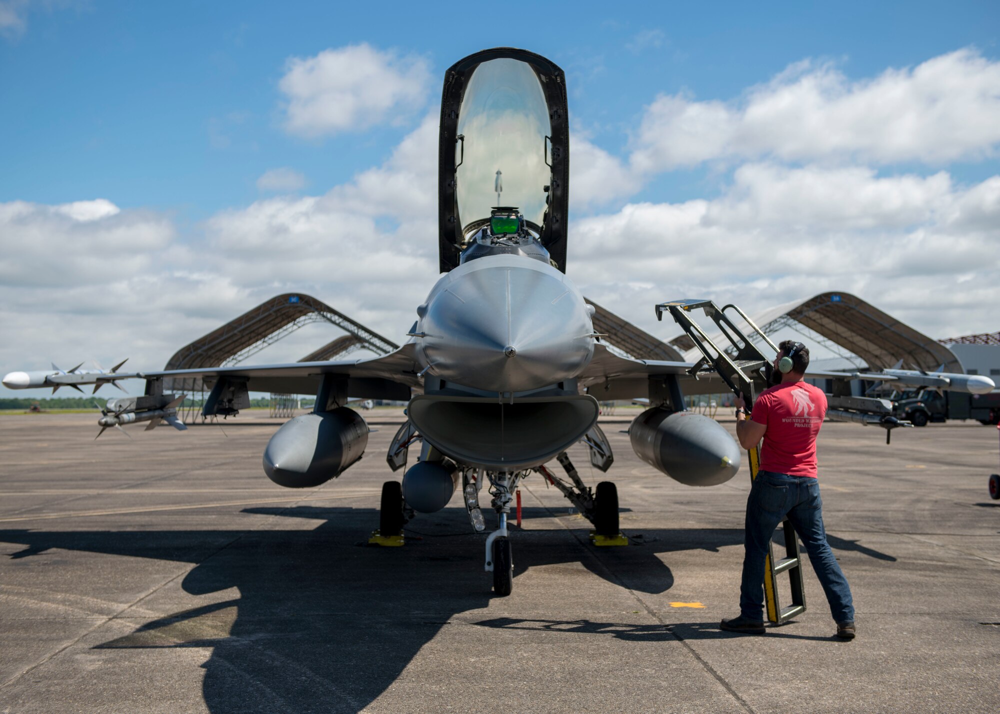 An 8th Fighter Squadron maintainer brings a ladder to an F-16 Fighting Falcon pilot, April 9, 2019, on Naval Air Station Joint Reserve Base New Orleans, La. Of the 158 personnel that came on the temporary duty assignment, 106 were F-16 maintainers. (U.S. Air Force photo by Airman 1st Class Kindra Stewart)