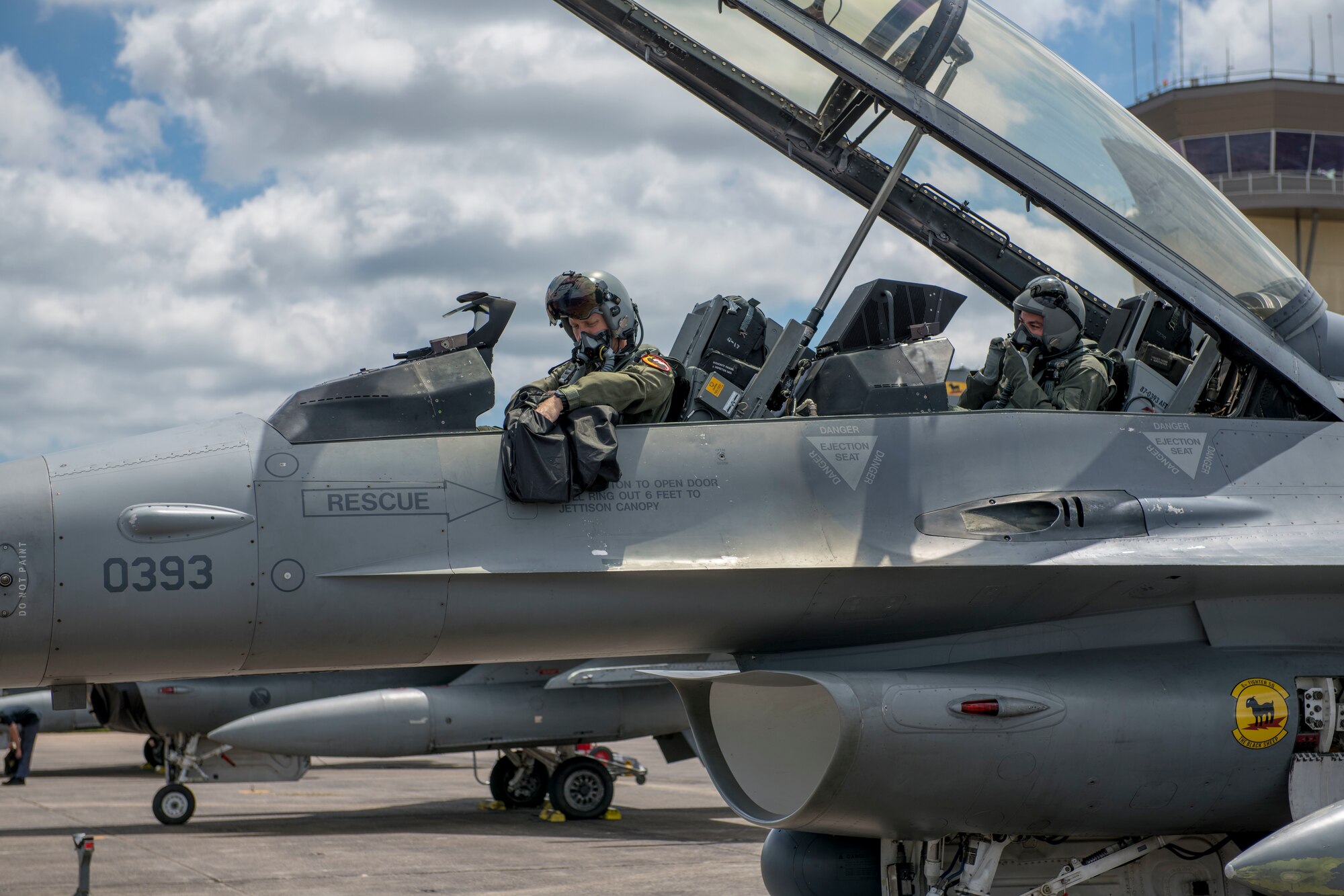 U.S. Air Force Maj. Nathaniel Lightfoot, 8th Fighter Squadron F-16 Basic-Course instructor, prepares to take Tech. Sgt. Andrew Bean, 8th FS medical element operations section chief, on a familiarization flight, April 9, 2019, on Naval Air Station Joint Reserve Base New Orleans, La. During the temporary duty assignment, many personnel were given the opportunity to go on a FAM flight in the back of an F-16 D-model. (U.S. Air Force photo by Airman 1st Class Kindra Stewart)