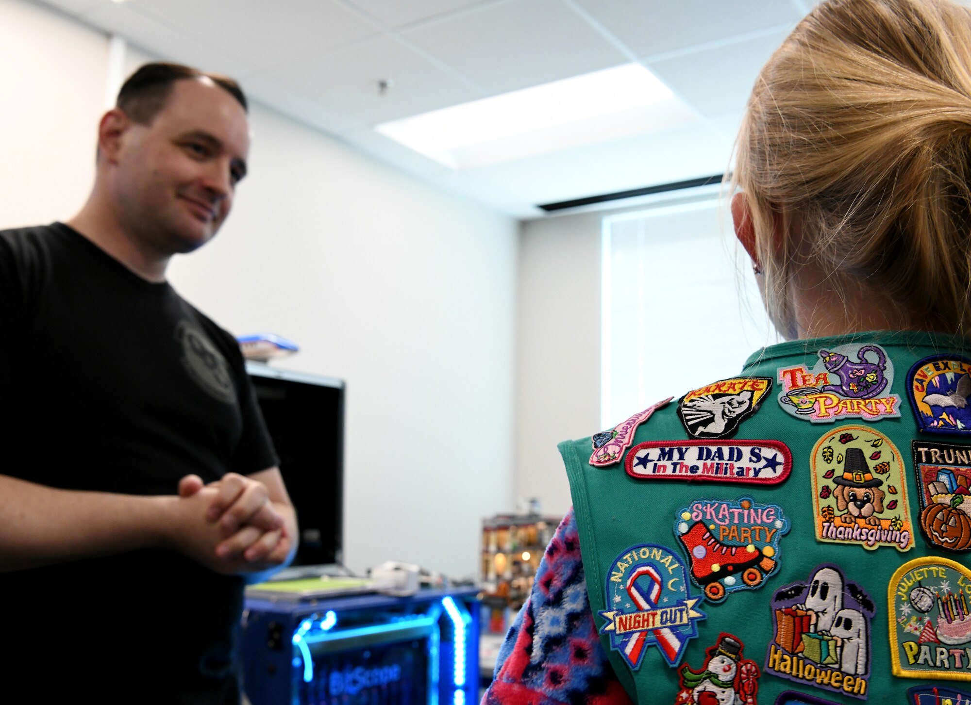 Cody Jackson, 90th Cyberspace Operations Squadron constructive modeler, hosts a “Bricks in the Loop” tour for local Girl Scouts in San Antonio, Texas, April 19, 2019. “Bricks in the Loop” mimics an Air Force installation with items such as a fire station, police station, airport, jets and tanker trucks, all used to simulate real-world cyber systems in training cyber operators. (U.S. Air Force photo by Tech. Sgt. R.J. Biermann)