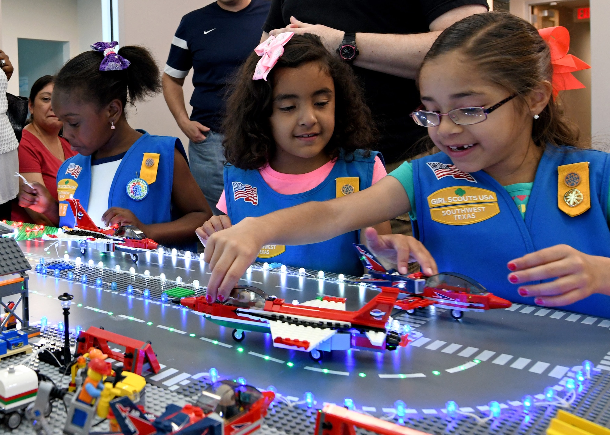 San Antonio-area Girl Scouts visit the 90th Cyberspace Operations Squadron “Bricks in the Loop” for a tour April 19, 2019. “Bricks in the Loop” mimics an Air Force installation with items such as a fire station, police station, airport, jets and tanker trucks, all used to simulate real-world cyber systems in training cyber operators. (U.S. Air Force photo by Tech. Sgt. R.J. Biermann)