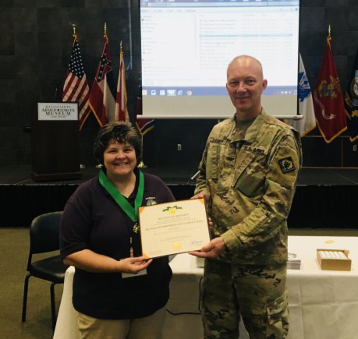 Rita McCarty has served as the Mississippi Army National Guard Cultural Resource Manager for 13 years. She was recognized by MSARNG Chief of Staff Col. Amos Parker with the Mississippi Meritorious Civilian Service Ribbon, the highest honor awarded to a civilian employee of the MSARNG. The Defense Department cited her program for an award.
