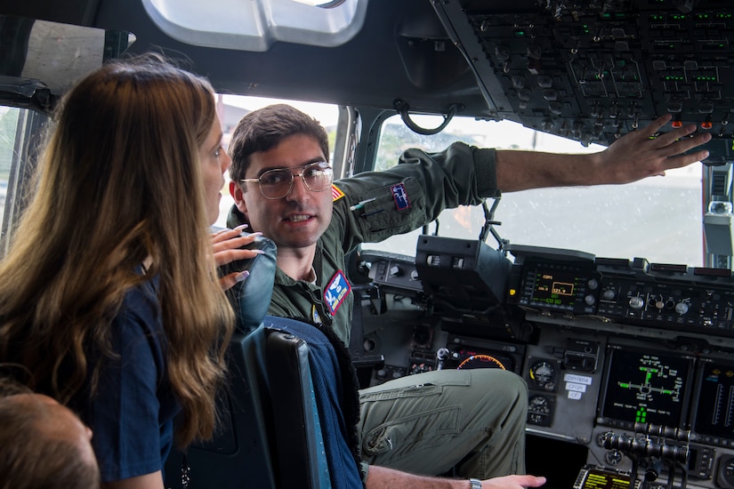 1st Lt. Derrin Gelston, 15th Airlift Squadron pilot, gives a cockpit tour to Take Flight Aviation Camp participants April 18, 2019 at Joint Base Charleston, S.C.