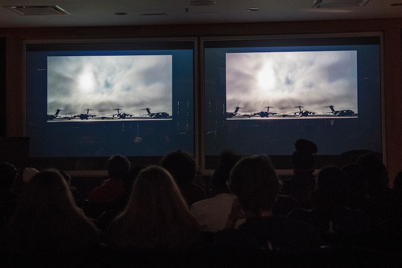 Students in the Take Flight Aviation Camp watch a 15th Airlift Squadron mission video before their tour starts April 18, 2019, at Joint Base Charleston, S.C.
