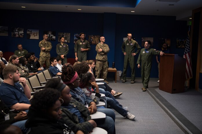 Retired U.S. Air Force Maj. Joshua Pugliese, former C-17 pilot, gives Take Flight Aviation Camp participants a briefing on his career and experiences before their tour started April 18, 2019, at Joint Base Charleston, S.C.
