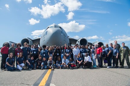 Participants from the Take Flight Aviation Camp pose in front of a C-17 Globemaster III April 18, 2019, at Joint Base Charleston, S.C.