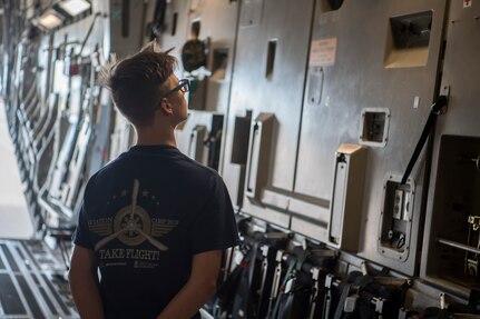 A participant in the Take Flight Aviation Camp tours a C-17 Globemaster III April 18, 2019, at Joint Base Charleston, S.C.