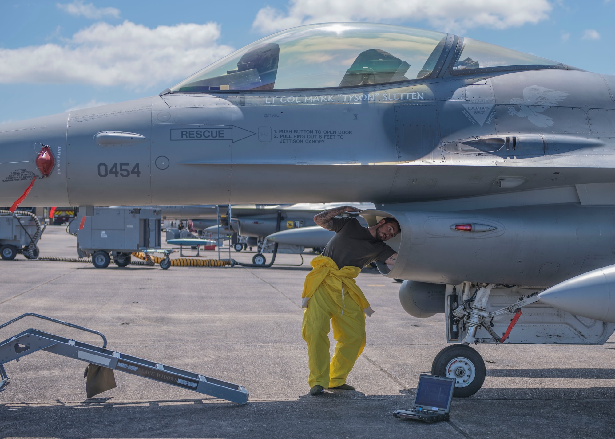 An 8th Fighter Squadron maintainer cleans the intake of an F-16 Fighting Falcon, April 9, 2019, on Naval Air Station Joint Reserve Base New Orleans, La. Lt. Col. Mark Sletten, 8th FS commander, said it was important to him to bring the entire squadron on the temporary duty assignment and train just as if they were going to fight. (U.S. Air Force photo by Airman 1st Class Kindra Stewart)