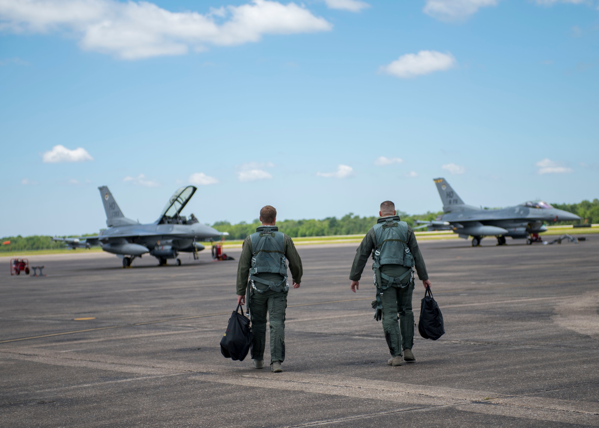 8th Fighter Squadron F-16 Fighting Falcon pilots step to their jets before a flight, April 9, 2019, on Naval Air Station Joint Reserve Base New Orleans, La. Holloman's 8th FS deployed on a temporary on a temporary duty assignment to Louisiana, and participated in training exercises, March 29, 2019 to April 12, 2019. (U.S. Air Force photo by Airman 1st Class Kindra Stewart)