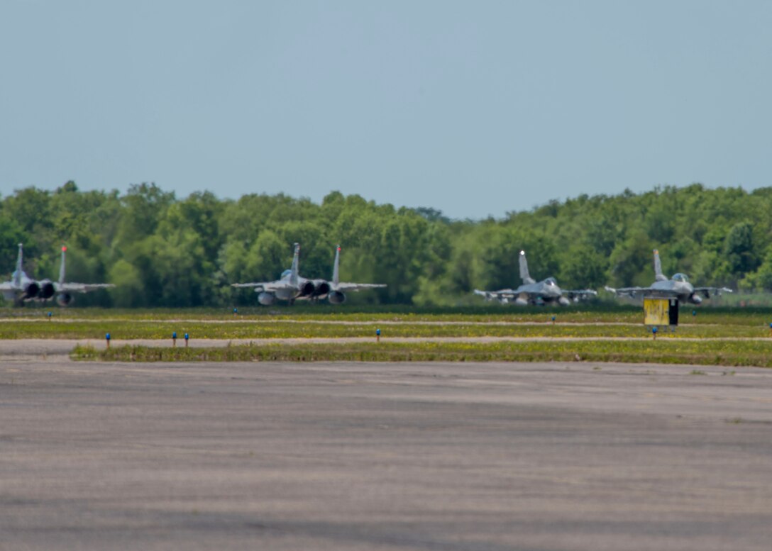 U.S. Air Force F-16 Fighting Falcons from Holloman's 8th Fighter Squadron, and F-15 Eagles from the Louisiana Guard National Guard's 159th Fighter Wing, taxi down the runway, April 10, 2019, on Naval Air Station Joint Reserve Base New Orleans, La. Pilots from the 8th FS participated in dissimilar aircraft training and close air support exercises with the Eagles from the 159th FW and joint terminal air controllers from the U.S. Army's 7th Special Forces Group. (U.S. Air Force photo by Airman 1st Class Kindra Stewart)