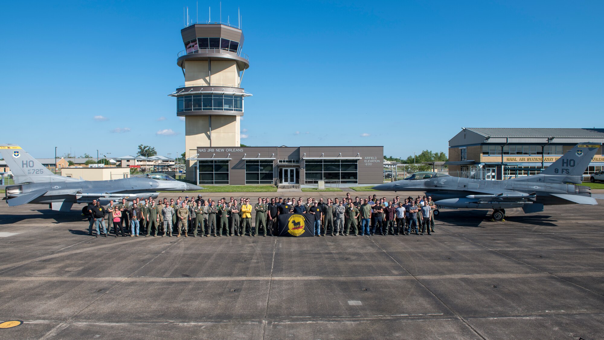 The 8th Fighter Squadron poses for a group photo, April 10, 2019, on Naval Air Station Joint Reserve Base New Orleans, La. No longer was the 8th FS in the high altitudes of the dry, brown desert of Holloman Air Force Base, N.M., but was now below sea level in the humid, deep south of Louisiana to conduct dissimilar aircraft training and close air support. (U.S. Air Force photo by Airman 1st Class Kindra Stewart)