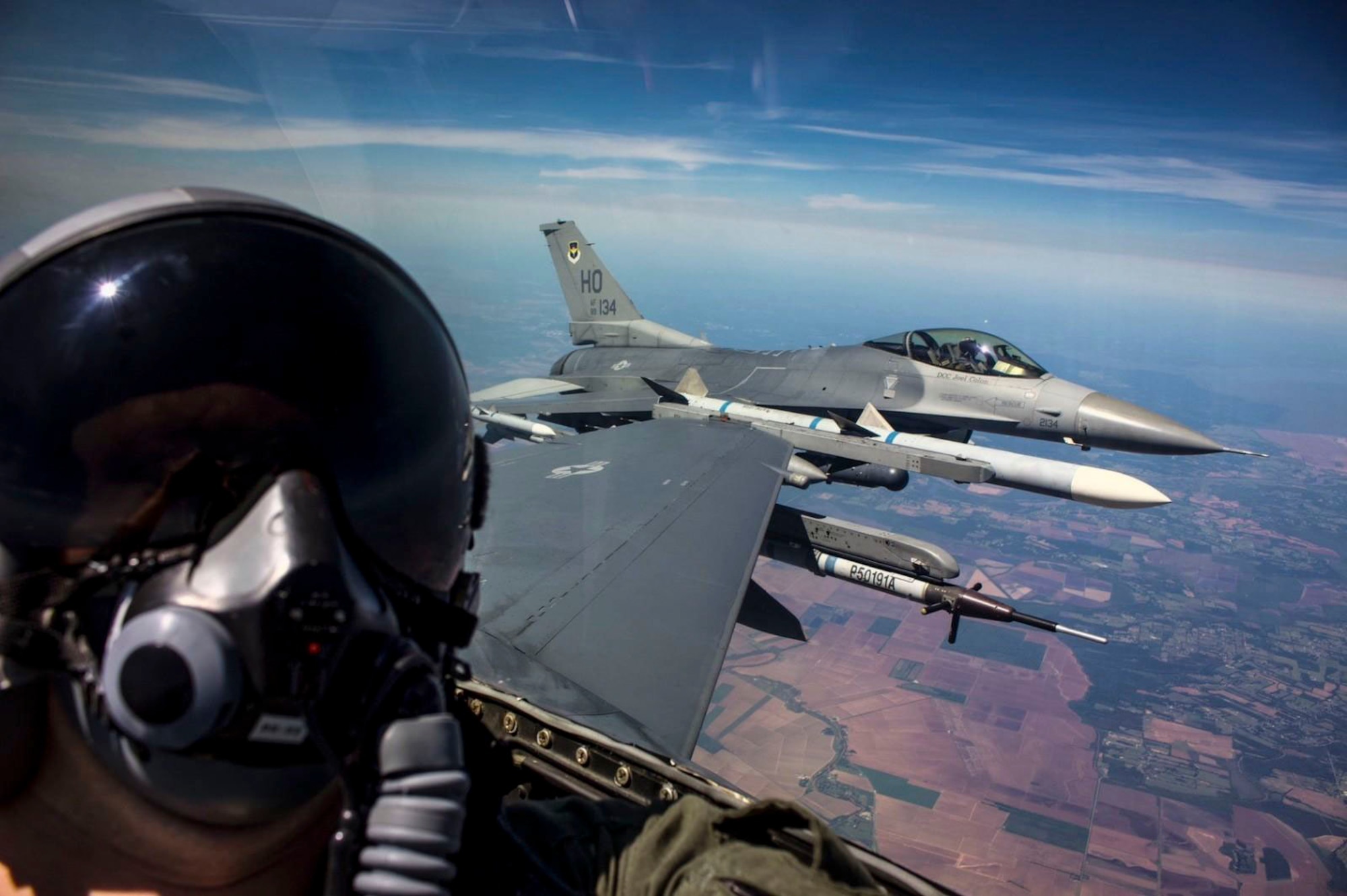 U.S. Air Force Senior Airman George Rahe, 54th Operations Support Squadron Aircrew Flight Equipment Airman, takes a selfie during a familiarization flight in an F-16 Fighting Falcon during a temporary duty assignment with the 8th Fighter Squadron, March 29, 2019 to April 12, 2019, at Naval Air Station Joint Reserve Base New Orleans, La. Many personnel were given the opportunity to go on a FAM ride in the back of an F-16 D-model during the TDY. (Courtesy photo by Senior Airman George Rahe)