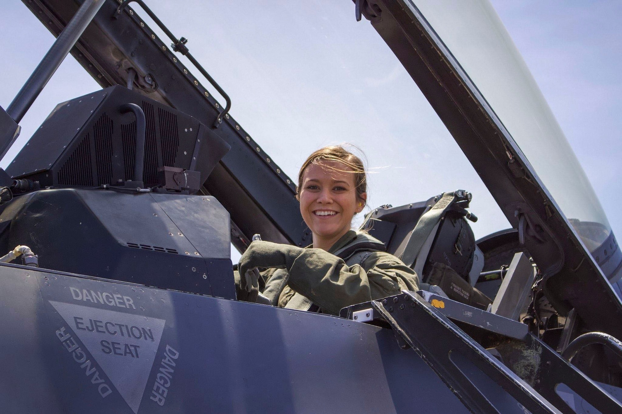 U.S. Air Force Airman Samantha Anderson, 54th Operations Support Squadron Aircrew Flight Equipment apprentice, poses for a photo before a familiarization flight in an F-16 Fighting Falcon during a temporary duty assignment with the 8th Fighter Squadron, March 29, 2019 to April 12, 2019, at Naval Air Station Joint Reserve Base New Orleans, La. Anderson said she experienced the gravitational pull of six times her body weight during her FAM flight. (Courtesy photo)