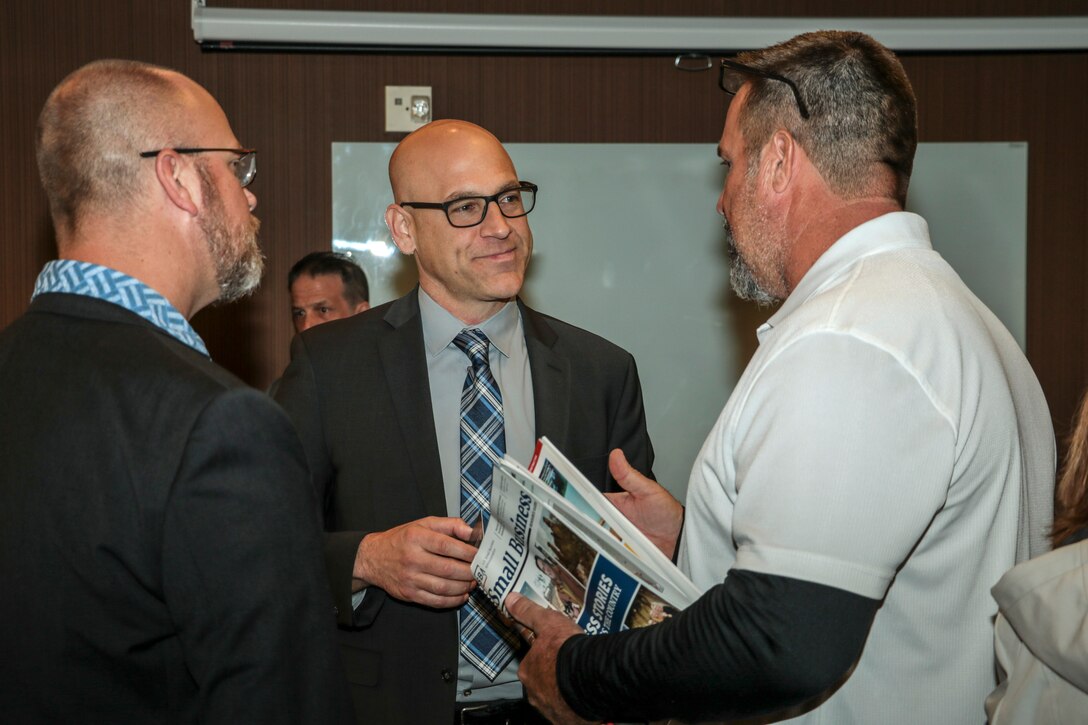 Eric Ravelli, deputy for the Small Business Program, speaks with attendees to the Los Angeles District Arizona-Nevada Area Office's Business Opportunities Open House March 14 in Scottsdale, Arizona. The Courtyard by Marriott location was sponsored by the American Indian Chamber of Commerce of California Procurement Technical Assistance Center. PTAC provides professional business consulting services and technical assistance to Native American-owned businesses regarding marketing and selling to the Federal, state, local and tribal governments and large prime contractors.