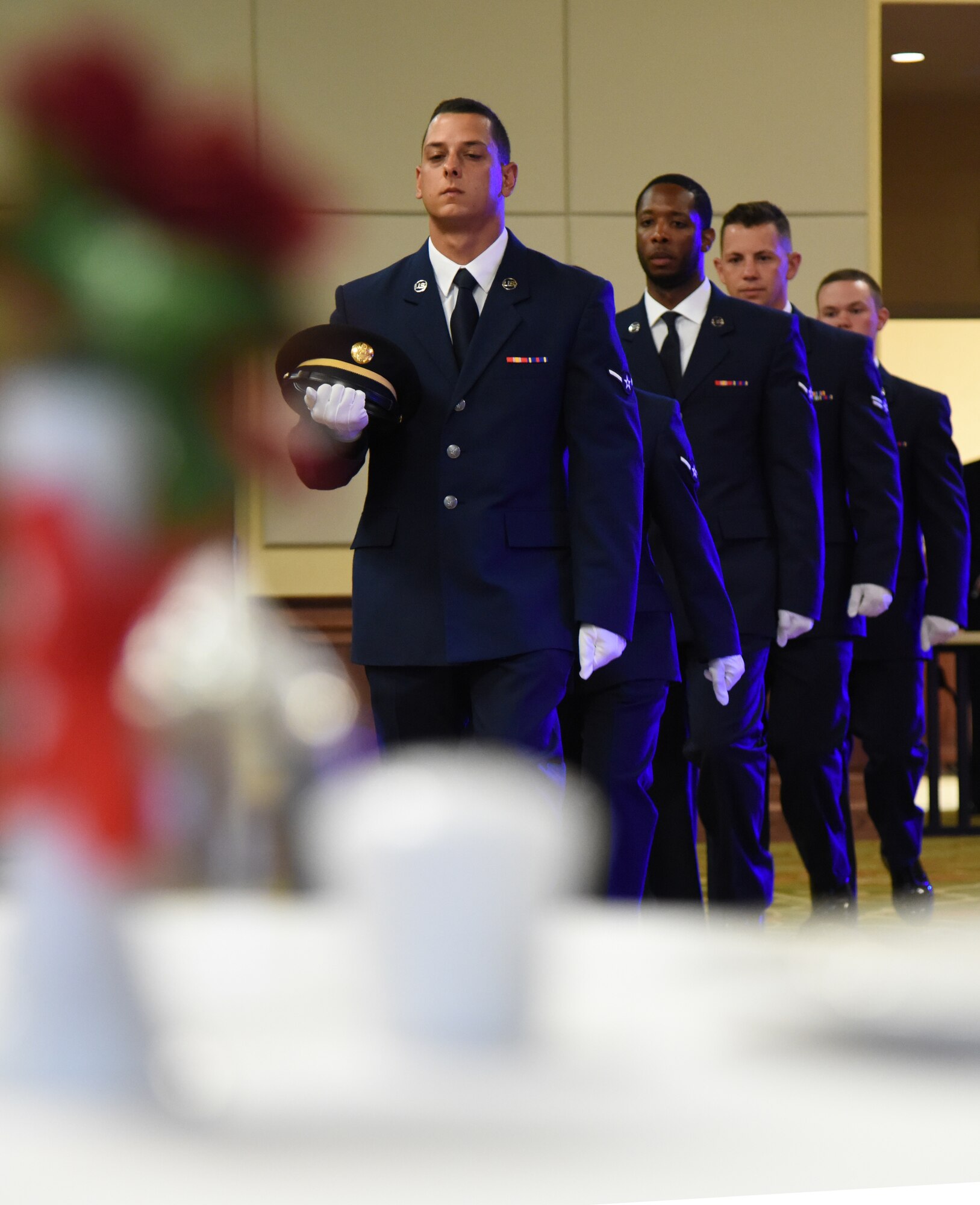 Airmen in the 81st Training Group participate in the POW/MIA table ceremony during the Airmen In Training Ball at the Bay Breeze Event Center on Keesler Air Force Base, Mississippi, April 19, 2019. The event, hosted by the 81st TRG, is the first of its kind and was geared toward training Airmen on how to participate and act during a formal military ball so they can feel confident in their abilities when arriving at their follow-on locations. The Airmen served in key positions throughout the ball such as emcees, color guard, POW/MIA table ceremony, national anthem singer and the invocation. (U.S. Air Force photo by Kemberly Groue)