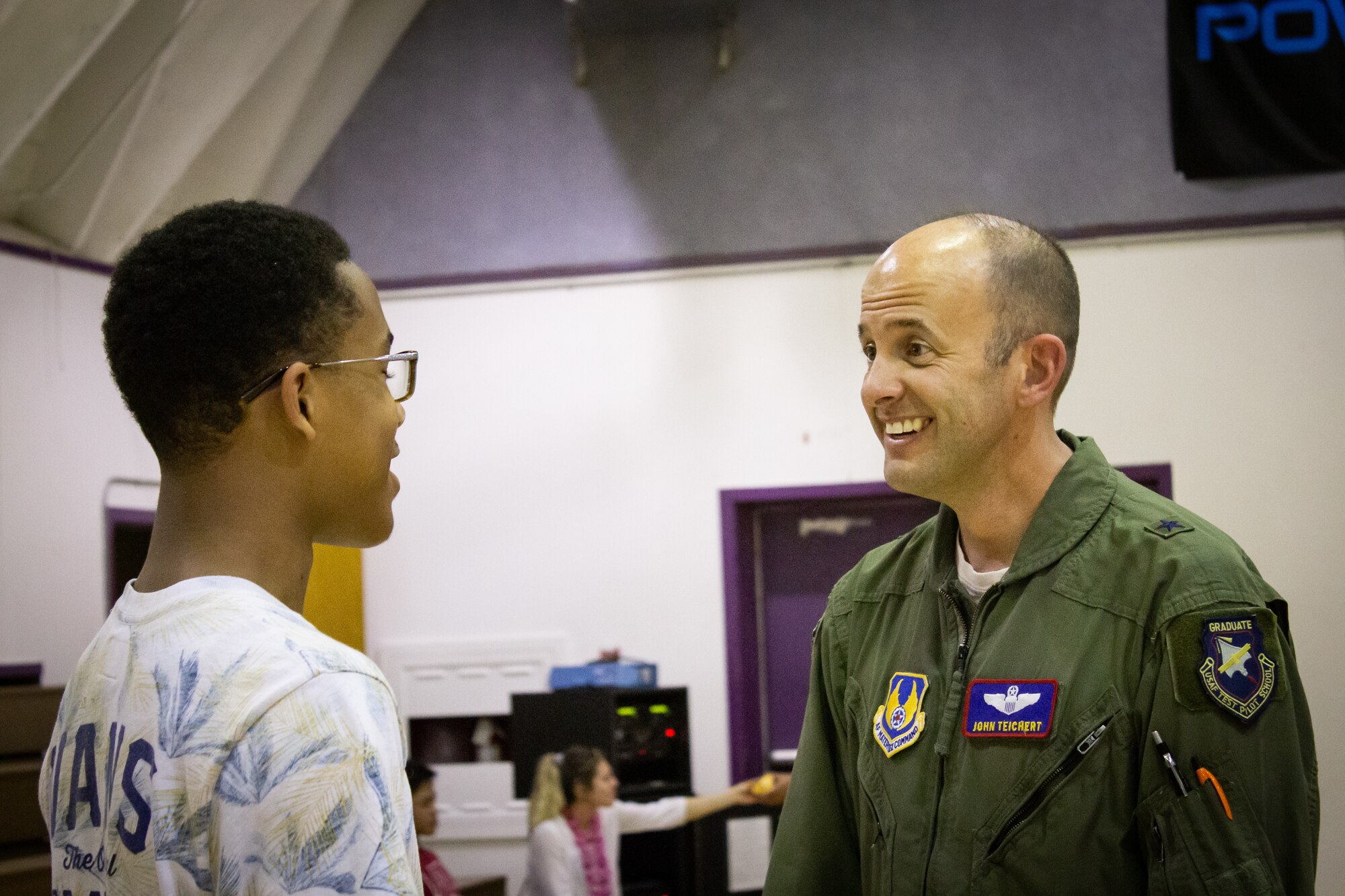 Brig. Gen. E. John Teichert, 412th Test Wing commander, talks with a Desert High School student at Edwards Air Force Base, Calif., April 18. Teichert commemorated the Month of the Military Child by personnally thanking the students for their service and support of their parents. (U.S. Air Force photo by Jade Black)