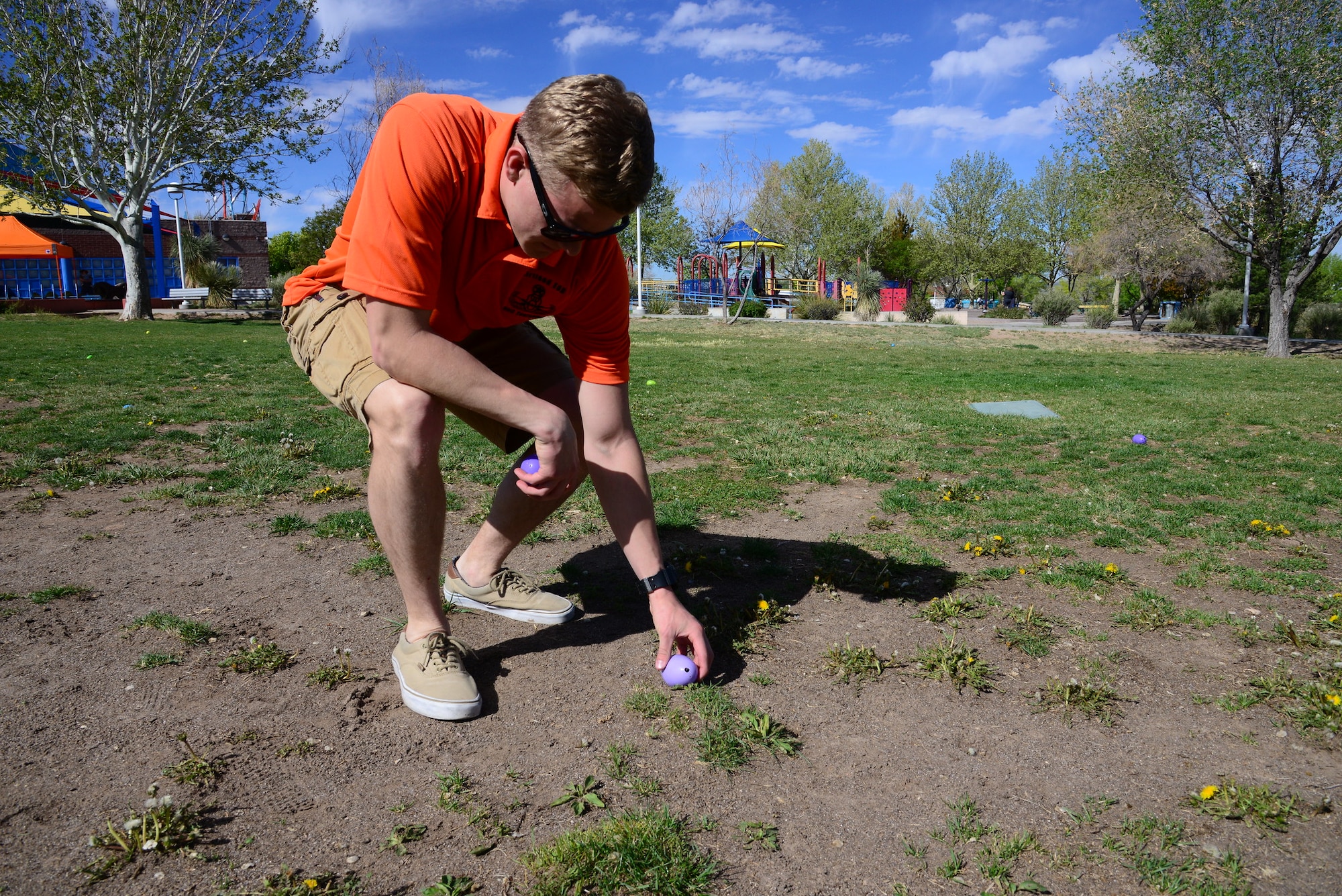 Airman 1st Class Jason Verhoef, 377th Explosive Ordnance Disposal, hides beeping Easter eggs during the third annual Beeping Easter Egg Hunt at Loma Linda Park in Albuquerque, NM, April 20, 2019. The eggs, made by EOD with a beeping mechanism, were hidden throughout the park for blind or impaired-vision children to find and trade in for candy and prizes. An EOD robot and suit were also on display for hands on exploration and questions. (U.S. Air Force video by Jessie Perkins)