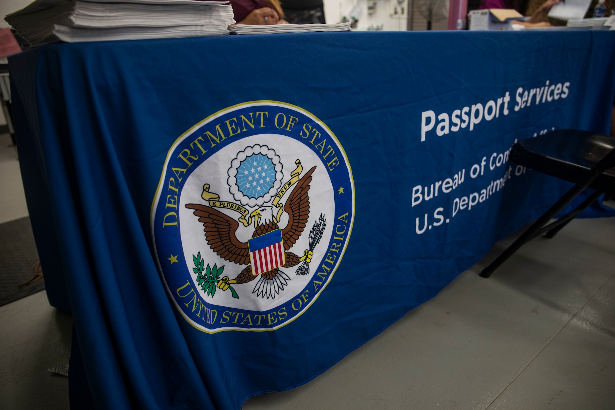 Representatives with the Hawaii State Department assist customers during a Passport Fair at the Marine Corps Base Hawaii Post Office, Mar. 10, 2019.