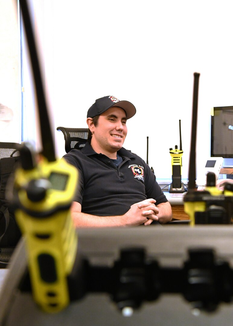 Caleb Holden, 104th Fighter Wing firefighter, prepares to answer 911 calls in the Fire Department alarm room April 18, 2019, at Barnes Air National Guard Base, Massachusetts. The firefighter on shift in the alarm room is reponsible for answering emergency calls and ensuring the proper aid is sent to assist.