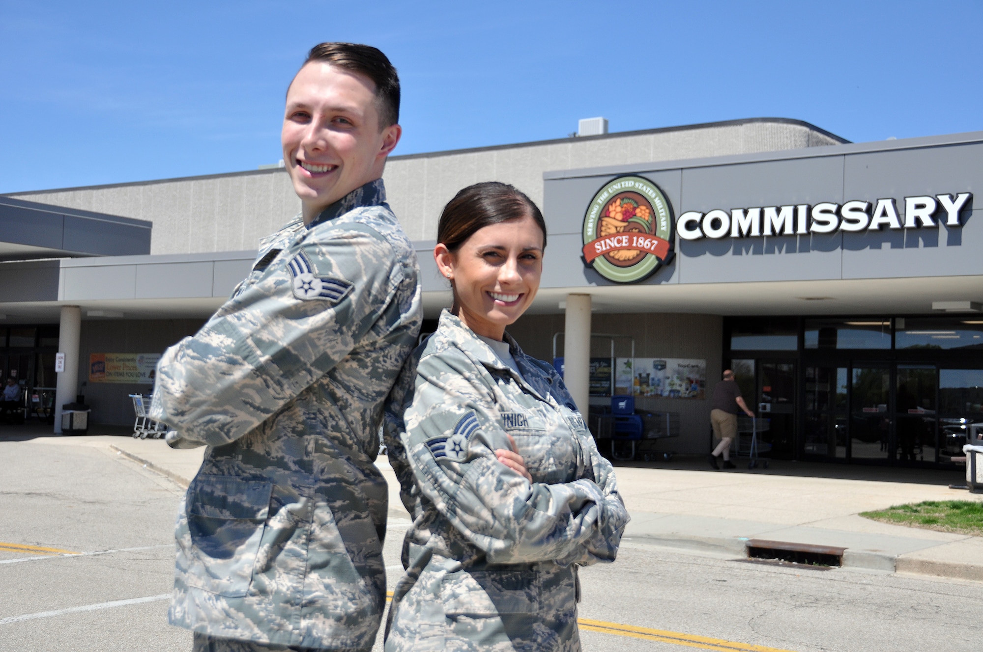 Senior Airmen Kassandra Minigh and Collin Millar, 14th Intelligence Squadron all-source analysts, provided aid to a customer having a seizure at the Wright-Patterson Air Force Base commissary March 27, 2019. Their efforts helped save the woman’s life.