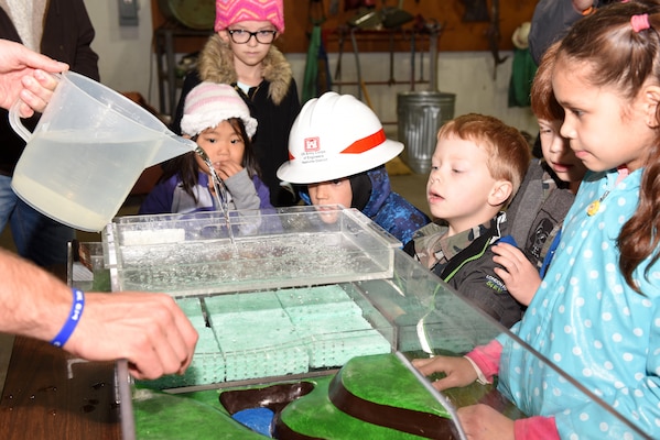 Kids participate in a practical exercise to learn about how development affects waterways and wetlands during the U.S. Army Corps of Engineers Nashville District Bring Your Family to Work Day April 19, 2019 at Old Hickory Dam on the Cumberland River in Old Hickory, Tenn.  (USACE photo by Lee Roberts)