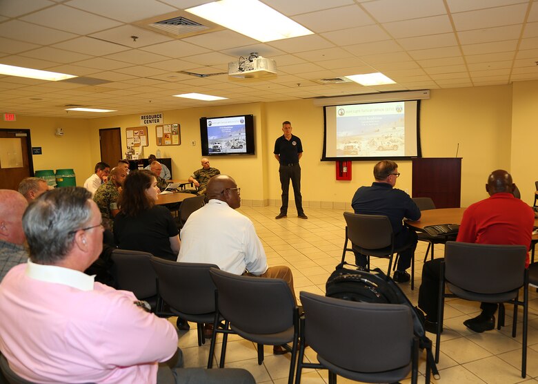 Andrew Rodgers, program manager, Light Tactical Vehicles, discusses the latest developments of the Joint Light Tactical Vehicle Program with attendees during a briefing held in the Marine Corps Logistics Command Multipurpose Room, April 9.
