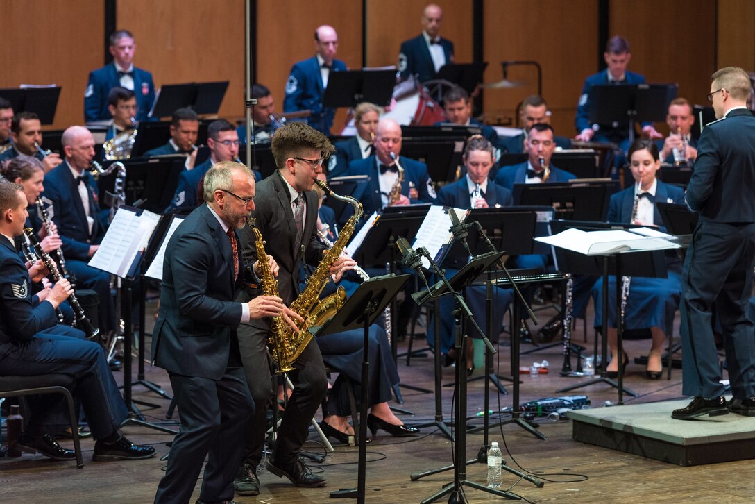 Internationally acclaimed saxophonist Joe Lulloff plays alongside his son, Jordan Lulloff, as they perform with the U.S. Air Force Concert Band on Thursday, Apr. 18, at the Rachel M. Schlesinger Concert Hall and Arts Center in Alexandria, Virginia. This concert was the final installment of The U.S. Air Force Band's 2019 Guest Artist Series. (U.S. Air Force photo by Master Sgt. Grant Langford)