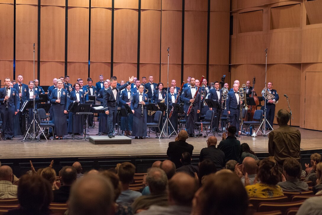Captain Dustin Doyle acknowledges the Concert Band on Apr. 18, during the final concert of The U.S. Air Force Band's 2019 Guest Artist Series. The concert featured internationally acclaimed saxophonist Joe Lulloff. (U.S. Air Force photo by Master Sgt. Grant Langford)