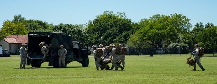 Navy Corpsmen perform a search and rescue demonstration April 20, 2019, at Joint Base San Antonio-Fort Sam Houston, Texas during the Fiesta and Fireworks Extravaganza. Fiesta honors the long-standing partnership between the U.S. military and San Antonio in annual Fiesta events, which commemorate Texas’ independence after the Battle of San Jacinto and the Alamo.  (U.S. Air Force photo by Senior Airman Stormy Archer)