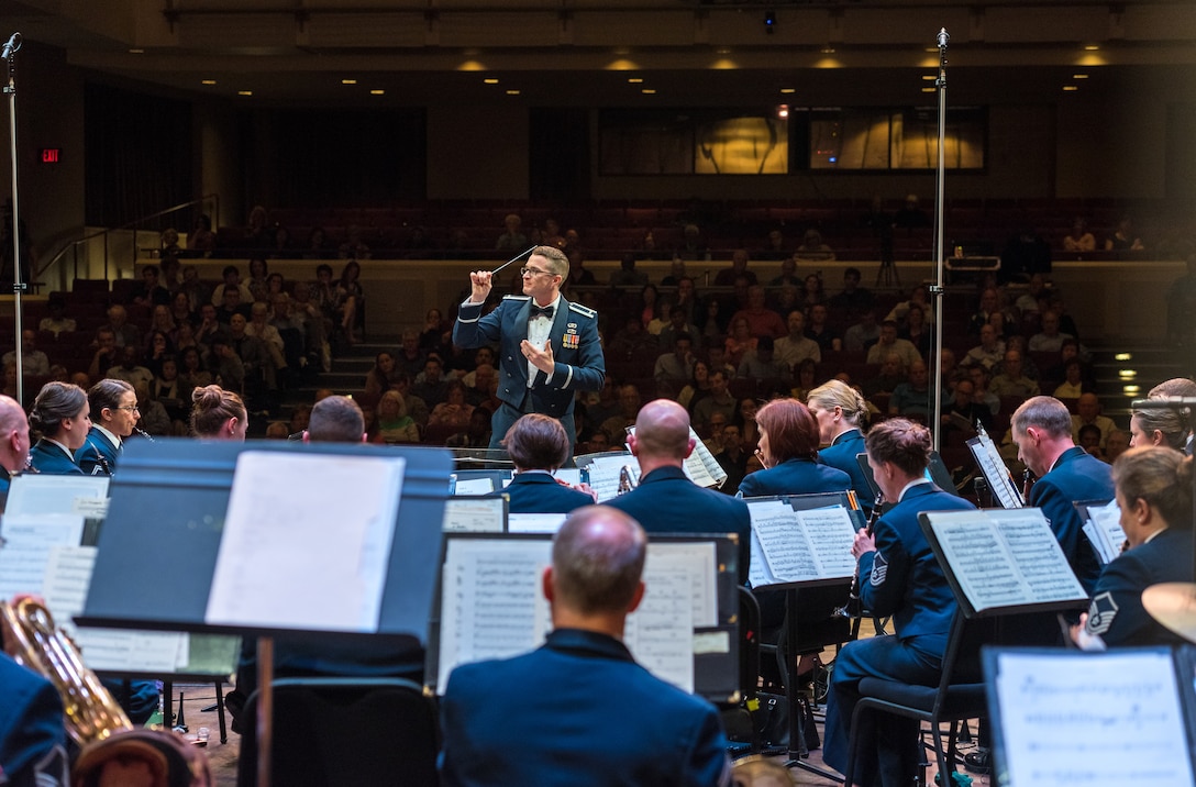 First Lieutenant Phillip Emory conducts the Concert Band on Apr. 18, during the final concert of The U.S. Air Force Band's 2019 Guest Artist Series. The concert featured internationally acclaimed saxophonist Joe Lulloff. (U.S. Air Force photo by Master Sgt. Grant Langford)