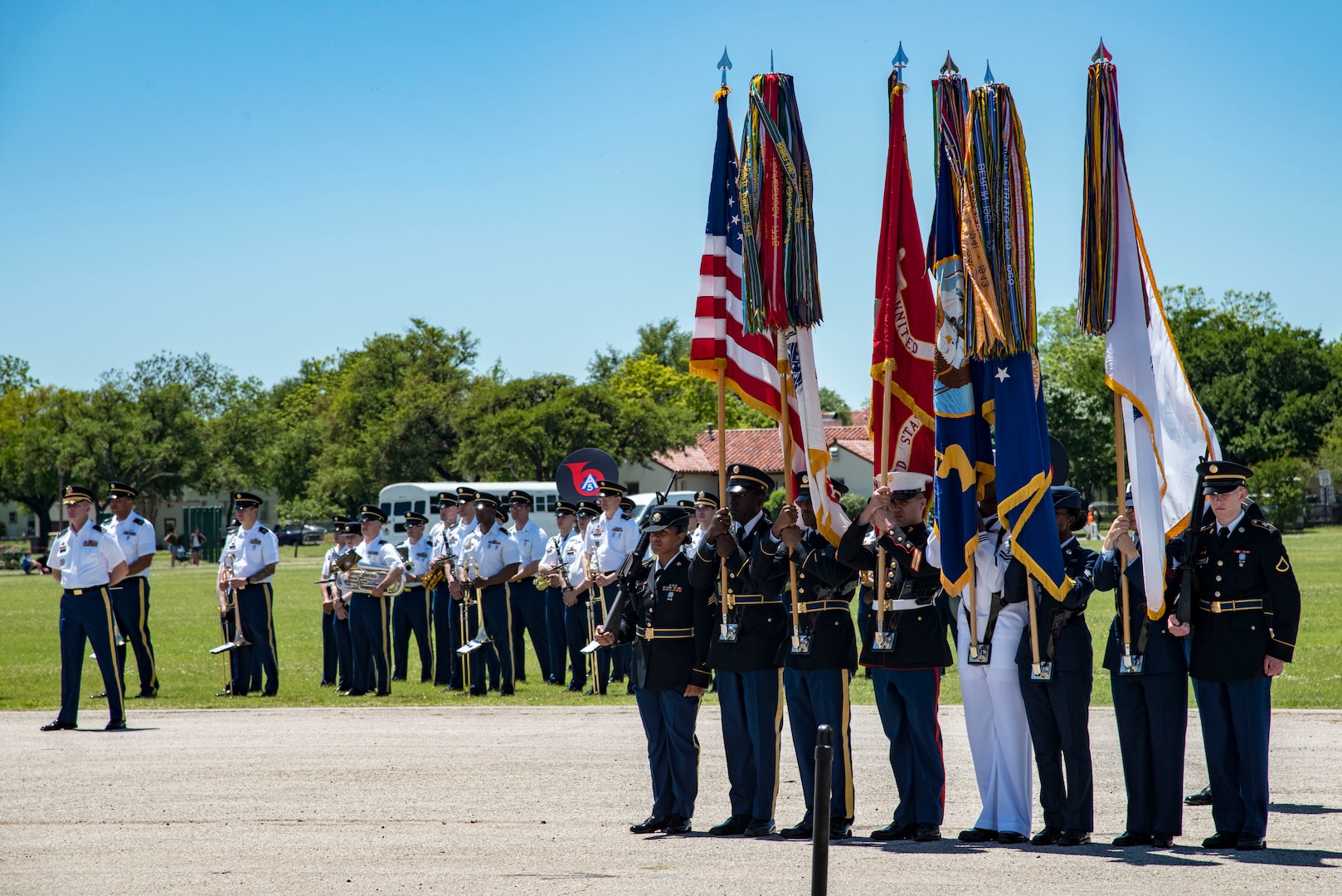 A joint service color guard presents the colors April 20, 2019, at Joint Base San Antonio-Fort Sam Houston, Texas during the Fiesta and Fireworks Extravaganza. Fiesta honors the long-standing partnership between the U.S. military and San Antonio in annual Fiesta events, which commemorate TExas’ independence after the Battle of San Jacinto and the Alamo.  (U.S. Air Force photo by Senior Airman Stormy Archer)