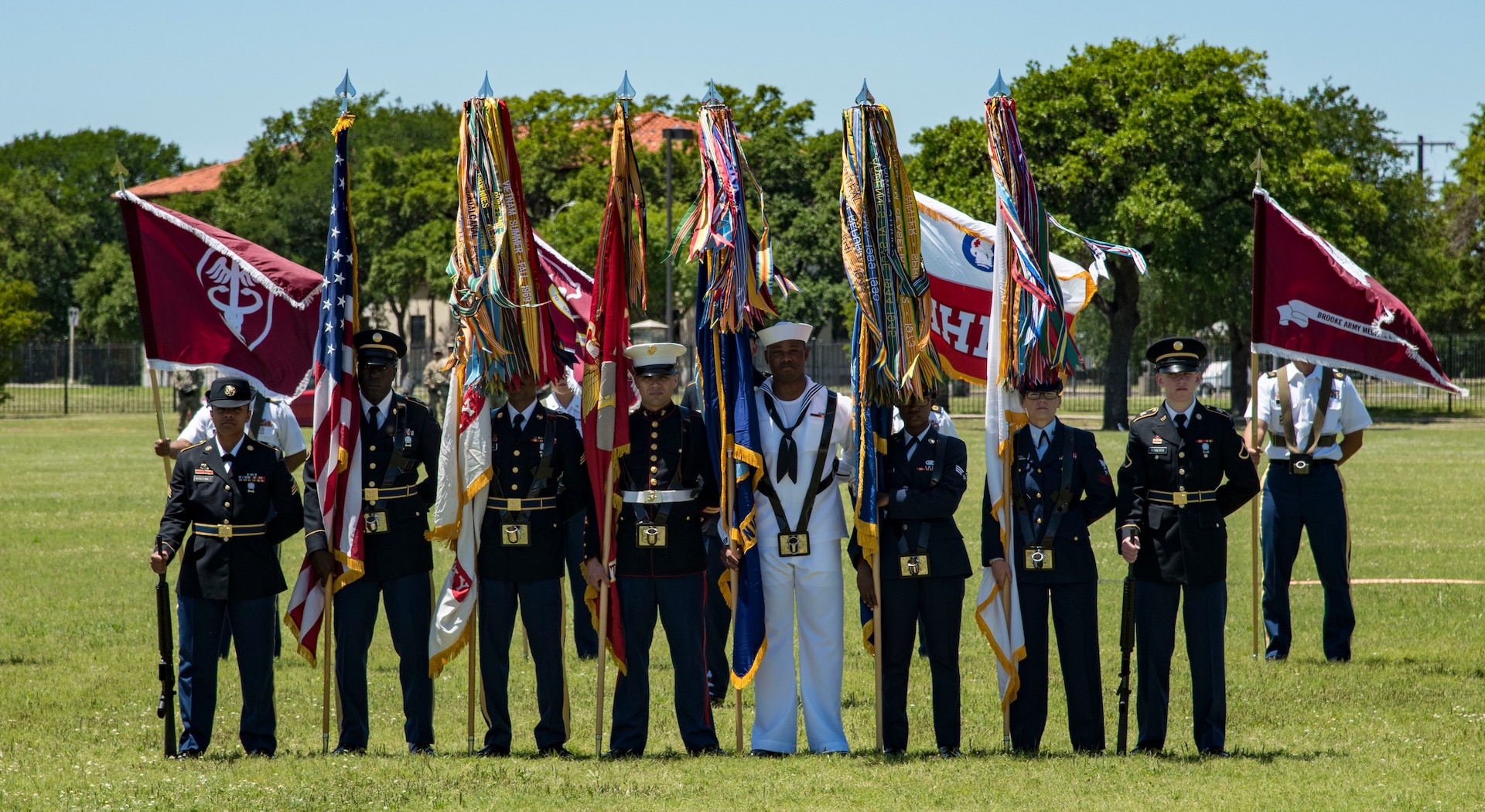 A joint service color guard presents the colors April 20, 2019, at Joint Base San Antonio-Fort Sam Houston, Texas during the Fiesta and Fireworks Extravaganza. Fiesta honors the long-standing partnership between the U.S. military and San Antonio in annual Fiesta events, which commemorate TExas’ independence after the Battle of San Jacinto and the Alamo.  (U.S. Air Force photo by Senior Airman Stormy Archer)