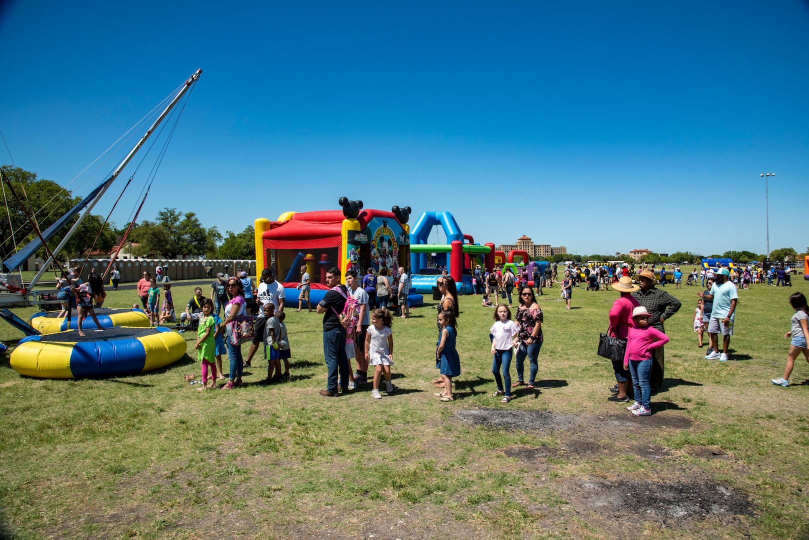 Families check out the attractions April 20, 2019, at Joint Base San Antonio-Fort Sam Houston, Texas during the Fiesta and Fireworks Extravaganza. Fiesta honors the long-standing partnership between the U.S. military and San Antonio in annual Fiesta events, which commemorate Texas’ independence after the Battle of San Jacinto and the Alamo.  (U.S. Air Force photo by Senior Airman Stormy Archer)