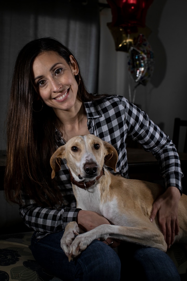 U.S. Air National Guard Staff Sgt. Dannielle Garcia and her dog Mina sit for a portrait in Lumberton, N.J., March 4, 2019. Garcia volunteered to care for Mina after she was found as a stray on a base in Kuwait in 2018, and had her shipped home in January of 2019. Garcia is an Emergency Management Specialist with the 108th Civil Engineer Squadron.